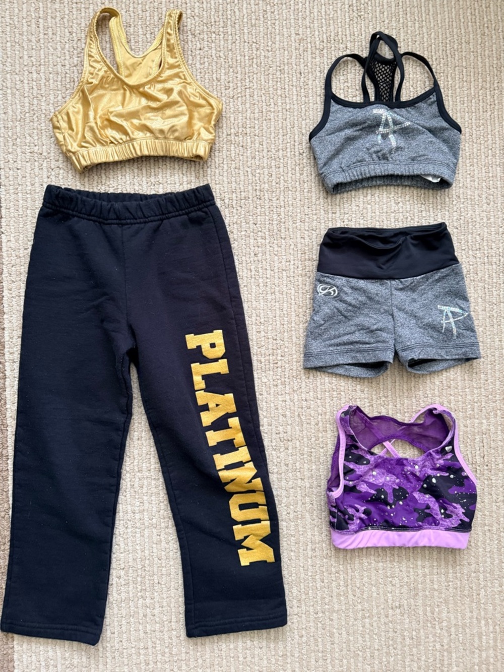Black 'PLATINUM' Sweatpants with gold Logo and more.